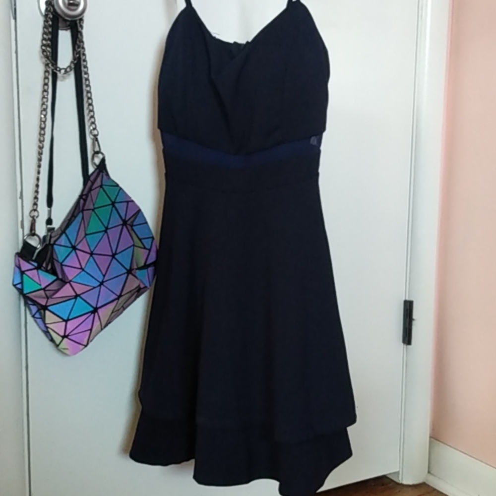 This is a dark navy blue dress. The brand is Emerald Sundae and it is the size M